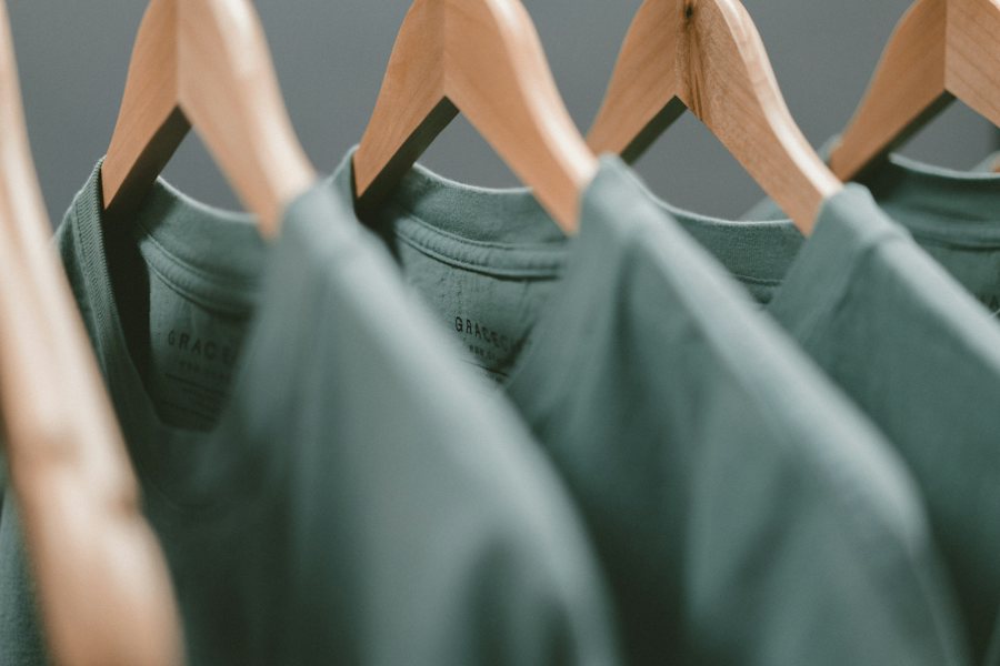 Neatly hung shirts in a clothing collection